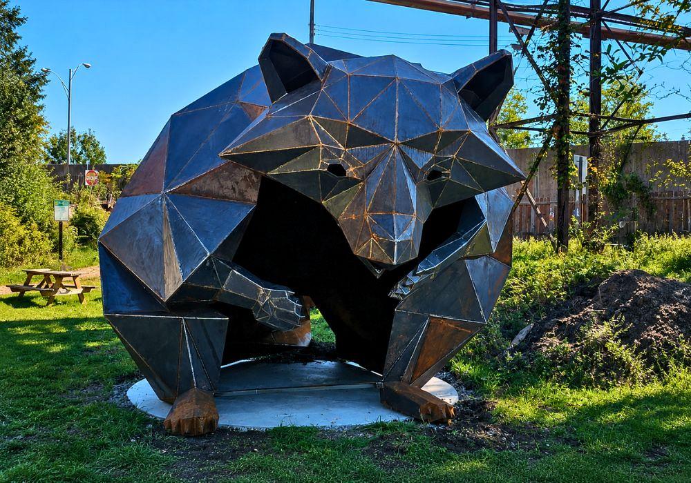 A 12.5-ft. steel raccoon sculpture sits in a park in Millvale, Pa.