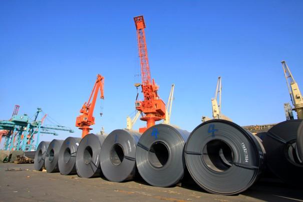 Steel coils sit in a shipyard in China.